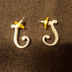 Silver earrings with detailing.